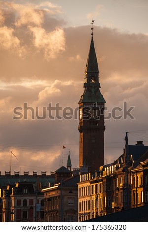 Clock tower in Copenhagen with cloudy sunset sky in background, Denmark