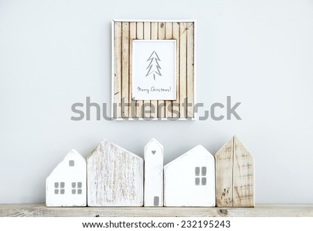 MERRY CHRISTMAS scandinavian or american style room interior with wooden frame and handmade small houses