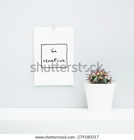 Hipster scandinavian style room interior. Mood board. Quote DO WHAT YOU LOVE, LOVE WHAT YOU DO. White pot with cactus.