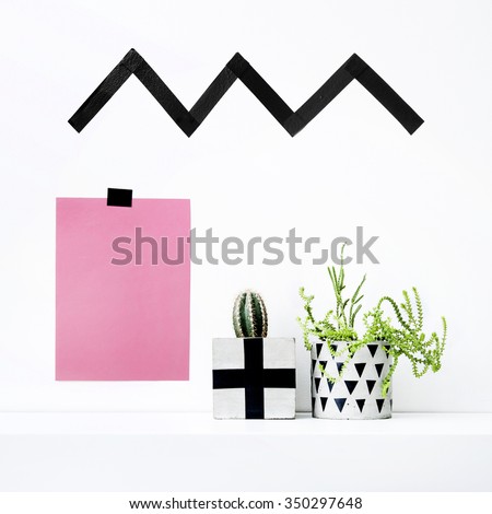 Scandinavian interior design. Hipster motivational quote with cactus and succulent in concrete pot. Washi tape wall and pot decoration. Mock up