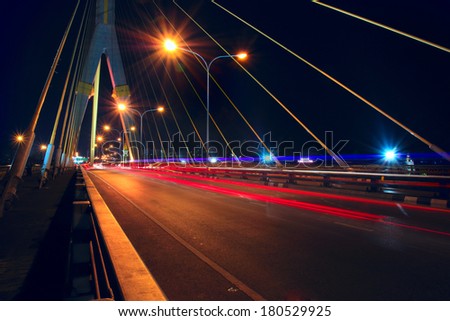 Large city road night scene, car light trails