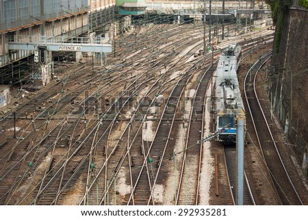 Paris, France. May 10 2015. Multiple track lines with train in Paris center from overhead bridge