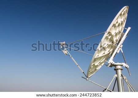 A satellite dish parabolic antenna communications satellites, which transmit data transmissions