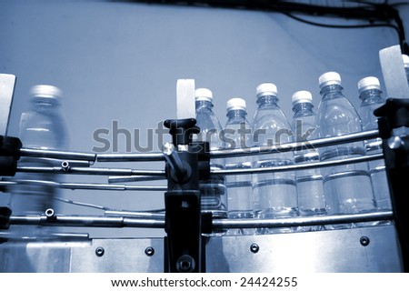 empty water bottles on factory conveyor belt