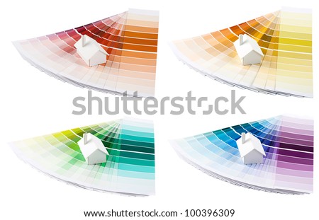Set of small simple white model house on a color palette with different colors of spectrum.