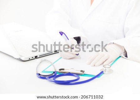 Doctor taking notes about patients blood pressure