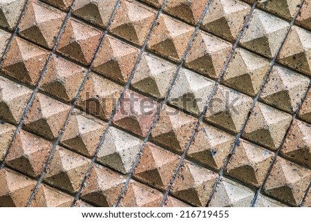 Pattern of triangular clay tiles, honeycomb tile pattern, yellow wall, Terra Cotta Tiles, Terracotta, earth tiles, triangular bricks. (Triangle embossed high)