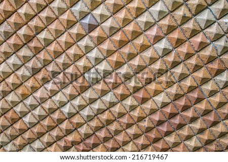 Pattern of triangular clay tiles, honeycomb tile pattern, yellow wall, Terra Cotta Tiles, Terracotta, earth tiles, triangular bricks. (Triangle embossed high)