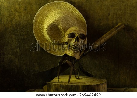 Still life skull . Cap machine weave and Agricultural tools