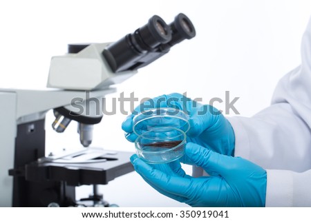 The scientists science. Check the DNA from the hair in the lab.