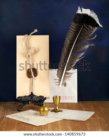 Blank Antique letter with feather pen and a candle