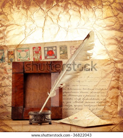 Old letters , vintage photo-frame and a quill pen