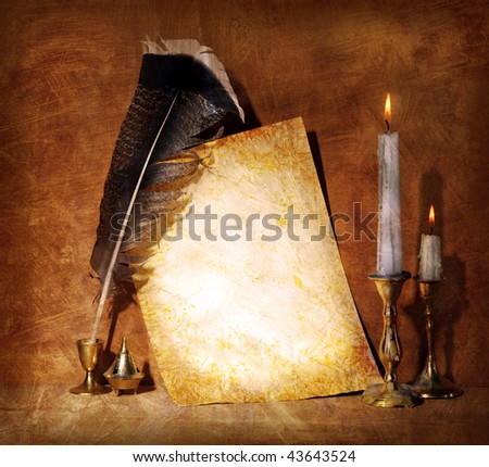 Old paper with a candle and a quill pen