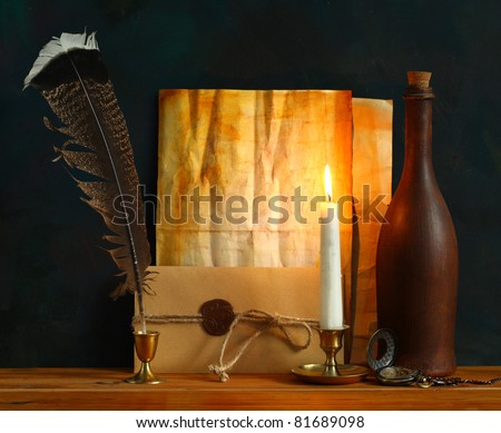Blank Antique letter with feather pen and a  candle
