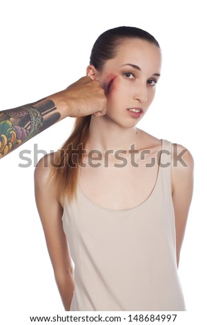 Young beautiful slender girl with a wound on his face hit man's hand