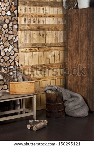 stack of wood, the wood boards, bench with storage compartment in the back room