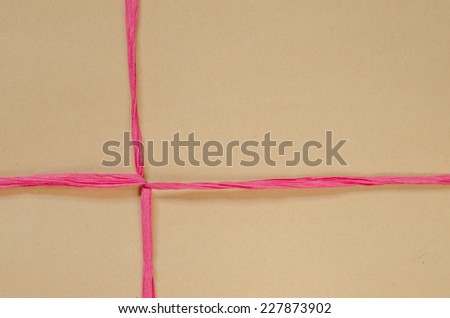 brown cardboard package background tied with twine