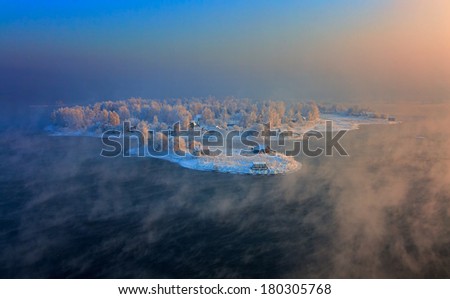 Island in the city of Irkutsk on the Angara River in winter in January.