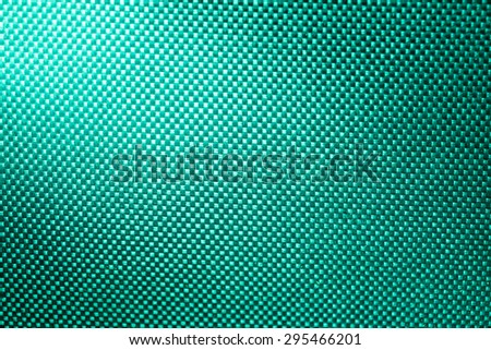 turquoise fabric nylon background texture with light from corner