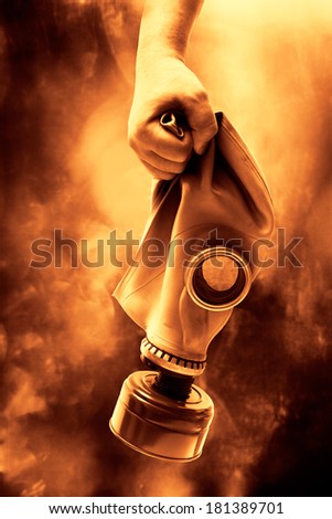Man holding in hand a gas mask