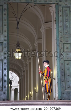 VATICAN CITY, ITALY - May 21: Vatican guard stands in front of Vatican Museum on May 21 2010 in Vatican, Rome, Italy. The Swiss Guards are responsible for the security of Vatican.