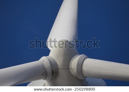 Wind mill turbine over the blue sky, Toronto, Canada