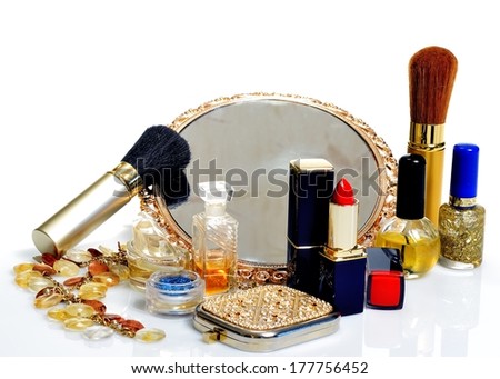 Items for decorative cosmetics, makeup, mirror and flowers