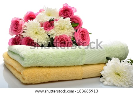 Towels and flowers for salon Spa, bath-houses and saunas