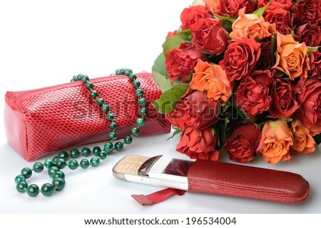 Items used by a woman cosmetic bag, malachite necklace, mobile phone and a beautiful bouquet of flowers in still life
