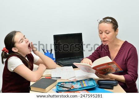 Schoolgirl teen girl listens the teacher and yawns