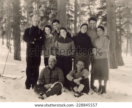 Ussr - CIRCA 1956s: An antique Black & White photo of group of friends posing near the snowy woods