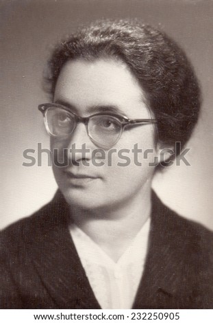 Russia, - CIRCA 1960s: An antique studio portrait of middle-aged Woman in a glasses