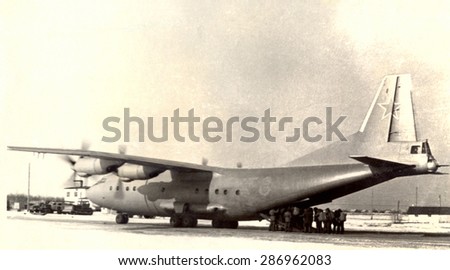 USSR, Russia, - CIRCA 1971: An antique black & white photo of airplane in airport on military base..