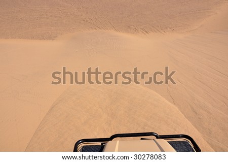 Driving down the sand dunes on Skeleton coast in Namibia
