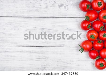 tomatoes on a white wooden table, pasta ingredients top view copy space
