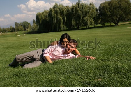 To fall in love, men and woman lying on green grass