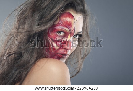 Girl zombie make-up for halloween holiday, half face beauty, another bloody