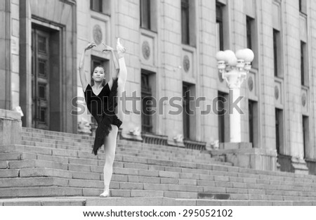 Girl ballerina flats standing on tiptoes on the street