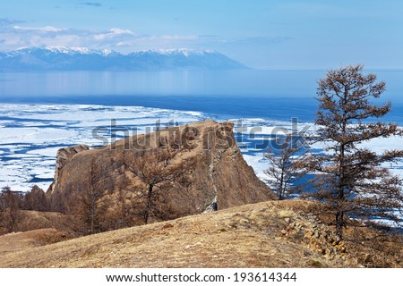 Ice drifting on Baikal Lake. View of Cape Khoboy - the northernmost cape on the Olkhon Island