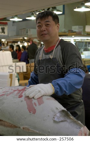 Worker in Tsukiji fish market, Tokyo, Japan
