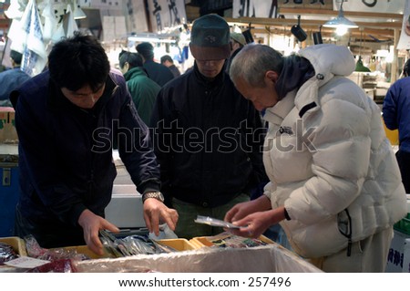 Workers in Tsukiji fish market, Tokyo, Japan