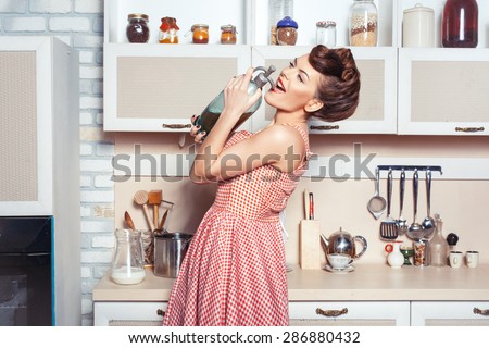 She is the mistress of the kitchen. She carried a bottle of soda. She sings in a bottle instead of a microphone.