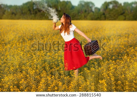 The girl runs on a field of yellow flowers. In her hand she holds a cup from which she drinks the magic smoke.