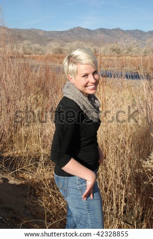 Portrait of a women looking at the camera in a northern Nevada landscape.