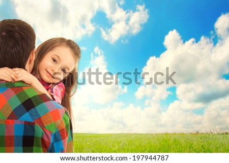 Little Girl hugs her father. Fathers day, family holiday, vacation