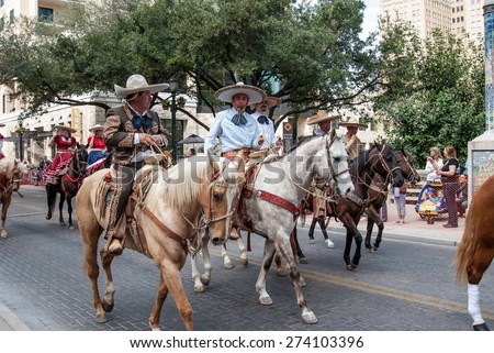 SAN ANTONIO, UNITED STATES- JANUARY 29, 2011: Latino cowboys herd cows before the San Antonio rodeo