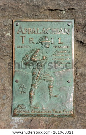DAHLONEGA, UNITED STATES- MAY 2: A copper plaque marks the beginning of the Appalachian Trail on Springer Mountain where hundreds of aspiring thru hikers begin their six month long trek, May 2nd, 2015