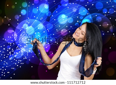 Young woman enjoying music, having fun and dancing at a club with her eyes closed, perfect for youth lifestyle, party or other celebration.