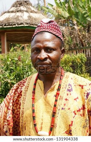 AFRICA,CAMEROON, FONGO-TONGO - JANUARY 20: African village Chief posing in traditional clothes on January, 20, 2013 Cameroon. Bamileke tribe is the dominant ethnic group in Cameroon\'s West Provinces.