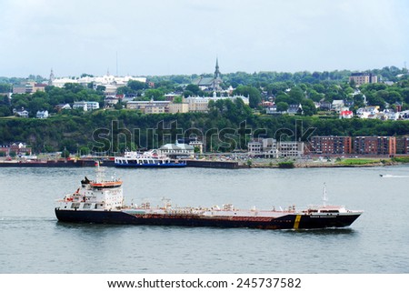 QUEBEC CITY, CANADA - JULY, 20: Large oil tanker in front of Quebec city in July 2014. Twenty-five million tonnes of crude oil and various petroleum products are transported on the St.Lawrence seaway